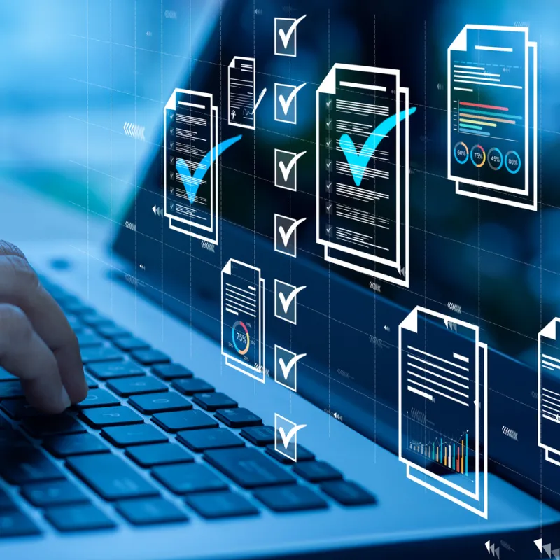 Person typing on a laptop keyboard with digital checklist icons and document graphics overlay.